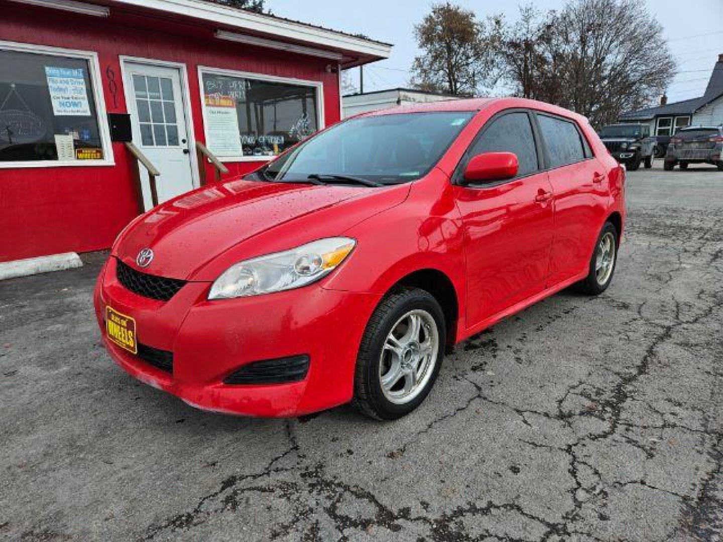 2009 Radiant Red Toyota Matrix Base 5-Speed MT (2T1KU40E09C) with an 1.8L L4 DOHC 16V engine, 5-Speed Manual transmission, located at 601 E. Idaho St., Kalispell, MT, 59901, 48.203983, -114.308662 - Photo#0