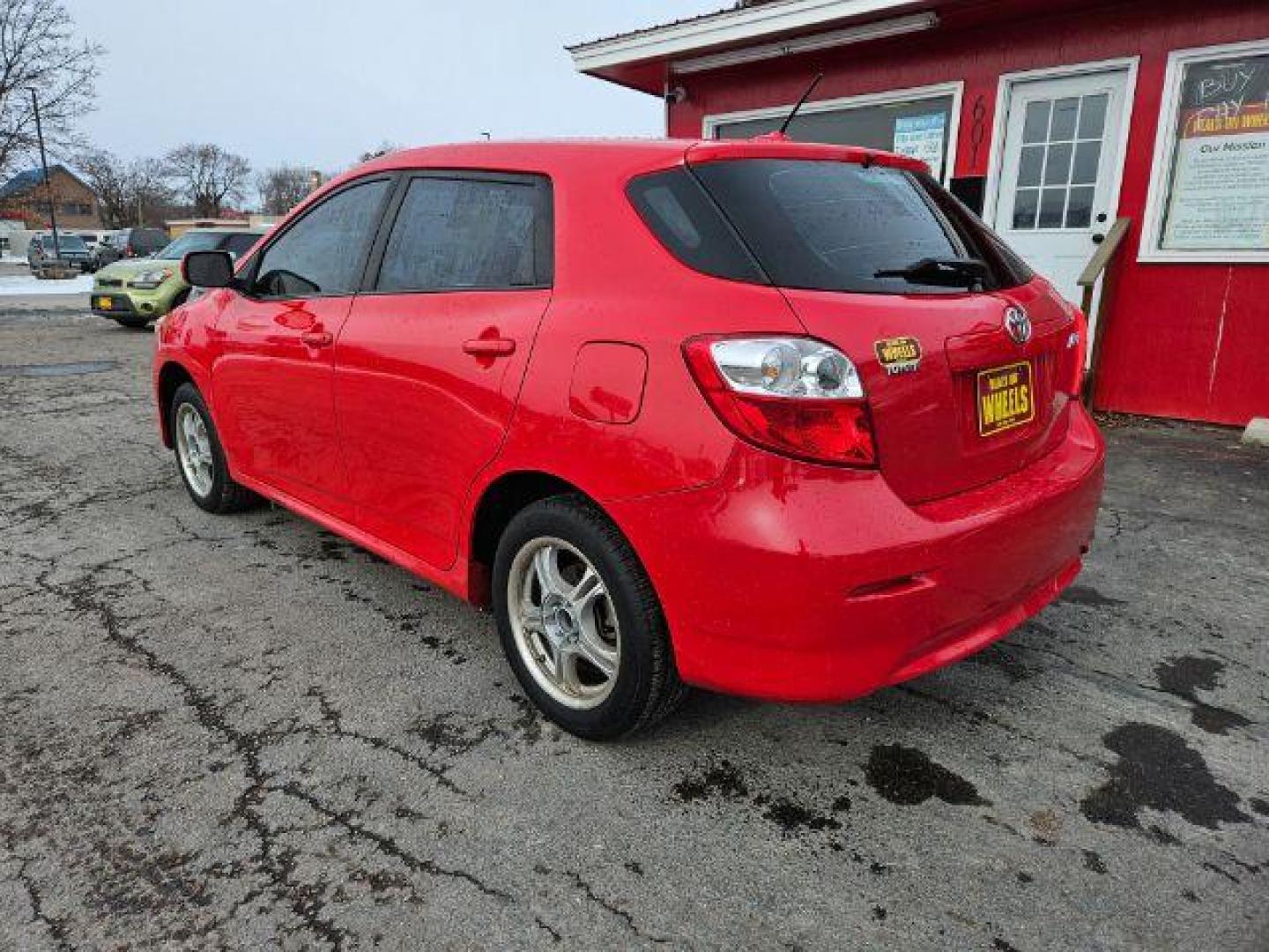 2009 Radiant Red Toyota Matrix Base 5-Speed MT (2T1KU40E09C) with an 1.8L L4 DOHC 16V engine, 5-Speed Manual transmission, located at 601 E. Idaho St., Kalispell, MT, 59901, 48.203983, -114.308662 - Photo#2