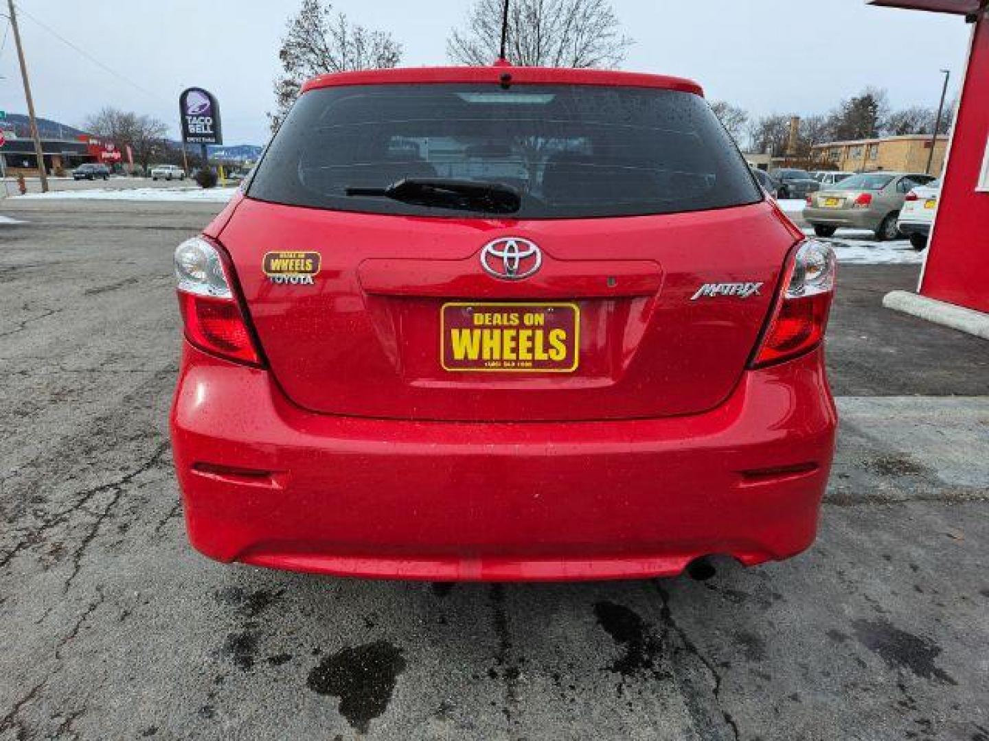 2009 Radiant Red Toyota Matrix Base 5-Speed MT (2T1KU40E09C) with an 1.8L L4 DOHC 16V engine, 5-Speed Manual transmission, located at 601 E. Idaho St., Kalispell, MT, 59901, 48.203983, -114.308662 - Photo#3