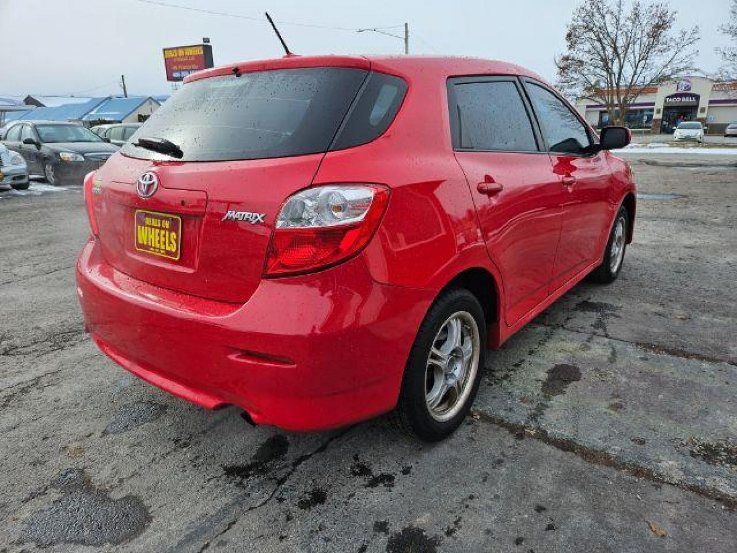 2009 Radiant Red Toyota Matrix Base 5-Speed MT (2T1KU40E09C) with an 1.8L L4 DOHC 16V engine, 5-Speed Manual transmission, located at 601 E. Idaho St., Kalispell, MT, 59901, 48.203983, -114.308662 - Photo#4