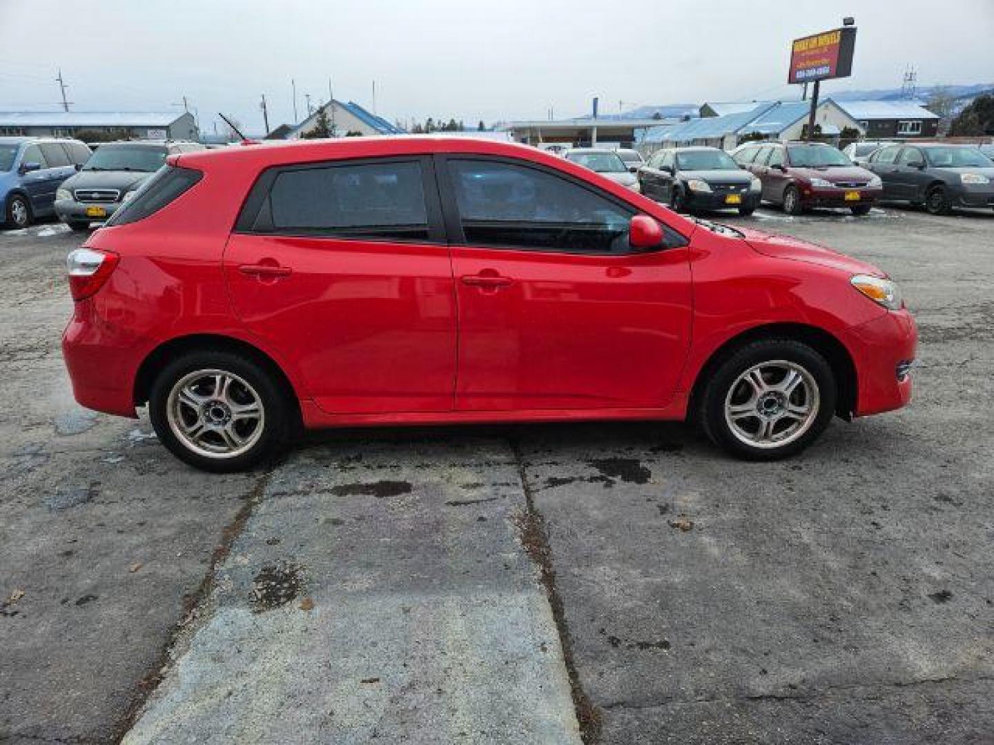 2009 Radiant Red Toyota Matrix Base 5-Speed MT (2T1KU40E09C) with an 1.8L L4 DOHC 16V engine, 5-Speed Manual transmission, located at 601 E. Idaho St., Kalispell, MT, 59901, 48.203983, -114.308662 - Photo#5