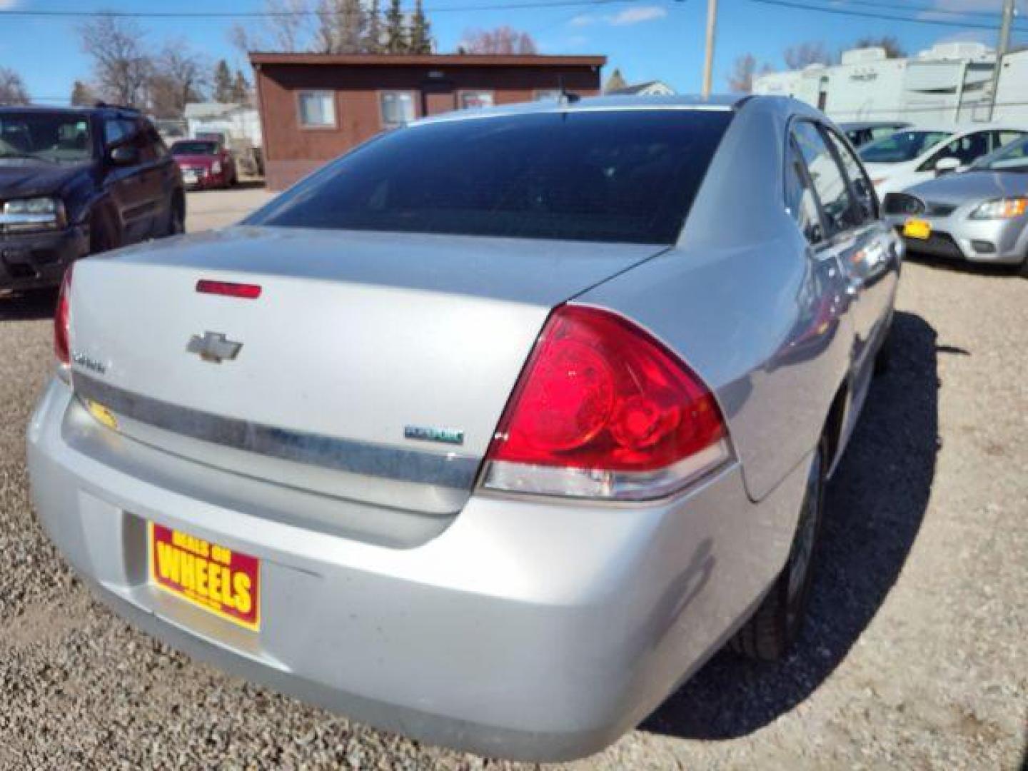 2011 Chevrolet Impala LS (2G1WA5EK3B1) with an 3.5L V6 OHV 16V FFV engine, 4-Speed Automatic transmission, located at 4801 10th Ave S,, Great Falls, MT, 59405, 47.494347, -111.229942 - Photo#4