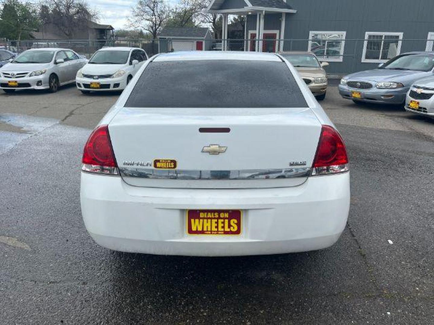 2011 Summit White Chevrolet Impala LS (2G1WF5EK9B1) with an 3.5L V6 OHV 16V FFV engine, 4-Speed Automatic transmission, located at 1821 N Montana Ave., Helena, MT, 59601, 46.603447, -112.022781 - Photo#4