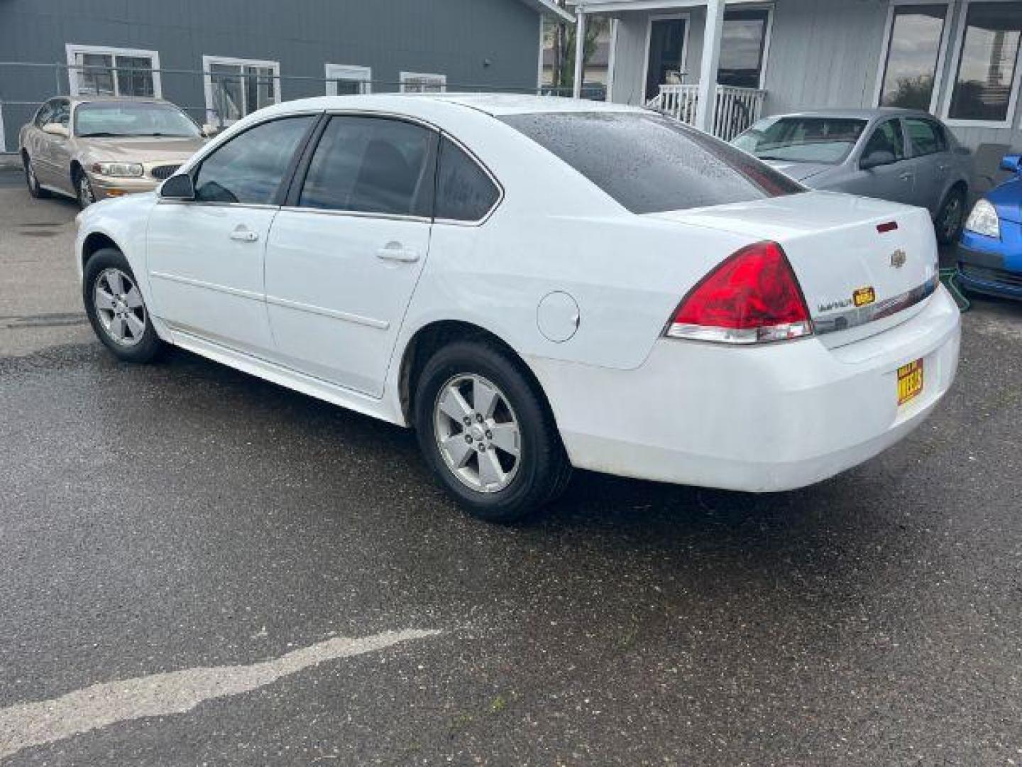 2011 Summit White Chevrolet Impala LS (2G1WF5EK9B1) with an 3.5L V6 OHV 16V FFV engine, 4-Speed Automatic transmission, located at 1821 N Montana Ave., Helena, MT, 59601, 46.603447, -112.022781 - Photo#5