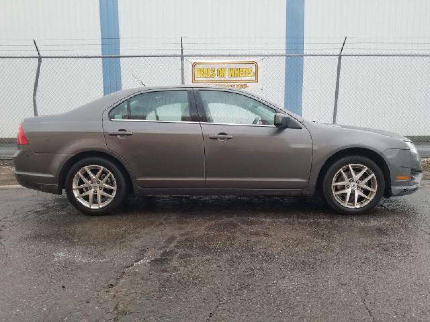 2011 Ford Fusion V6 SEL (3FAHP0JG4BR) with an 3.0L V6 DOHC 24V engine, located at 4801 10th Ave S,, Great Falls, MT, 59405, 47.494347, -111.229942 - Photo#3