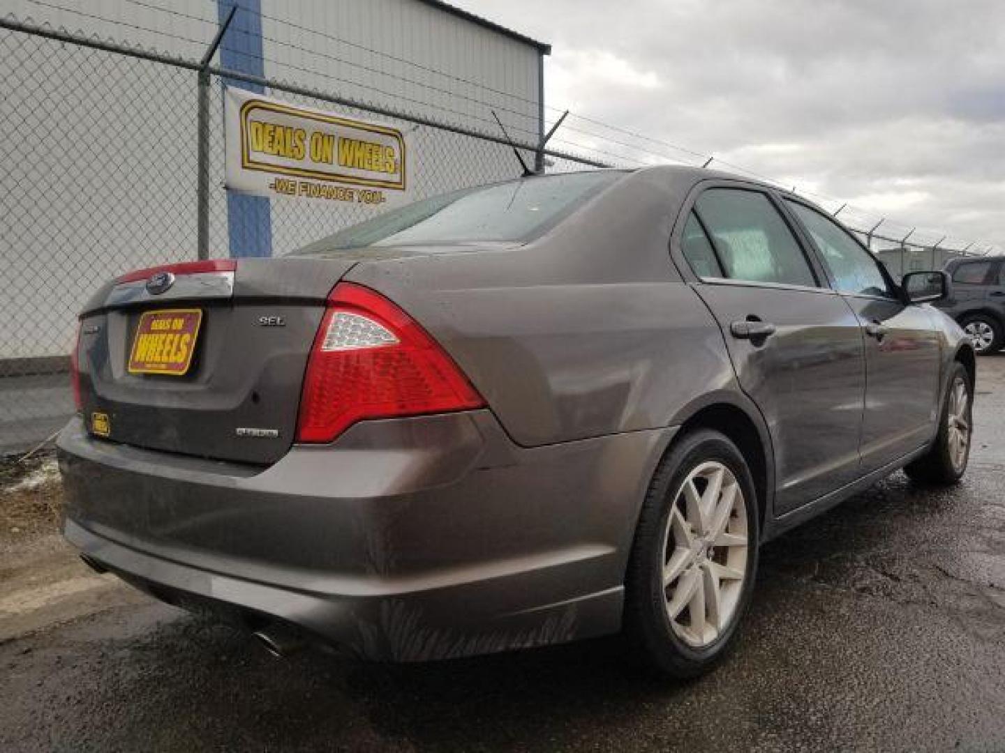 2011 Ford Fusion V6 SEL (3FAHP0JG4BR) with an 3.0L V6 DOHC 24V engine, located at 4801 10th Ave S,, Great Falls, MT, 59405, 47.494347, -111.229942 - Photo#4