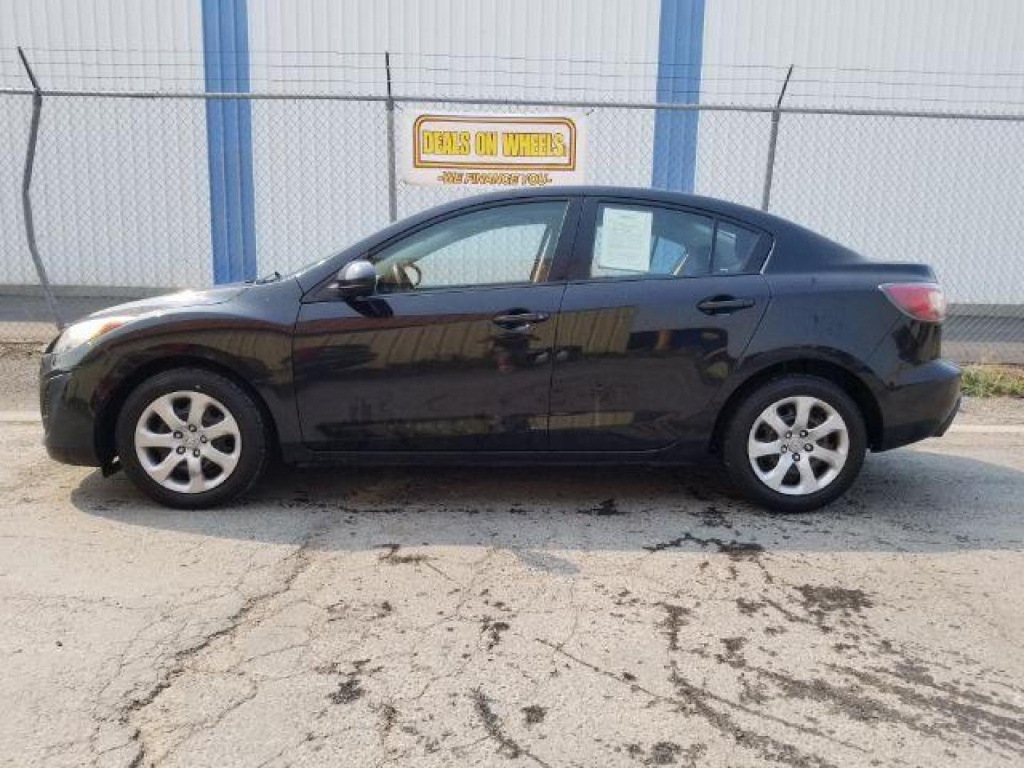 2011 Black Mica Mazda MAZDA3 i Sport 4-Door (JM1BL1UG6B1) with an 2.0L L4 DOHC 16V engine, located at 4801 10th Ave S,, Great Falls, MT, 59405, 47.494347, -111.229942 - Photo#2