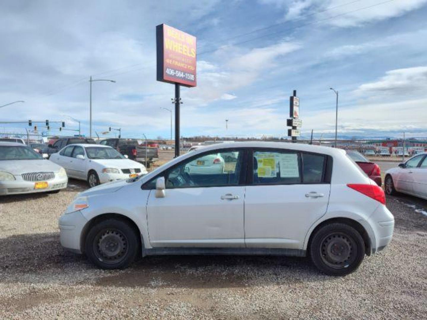 2011 Nissan Versa 1.8 SL Hatchback (3N1BC1CP9BL) with an 1.8L L4 DOHC 16V engine, 6 Speed Manual Trans transmission, located at 4801 10th Ave S,, Great Falls, MT, 59405, 47.494347, -111.229942 - Photo#1