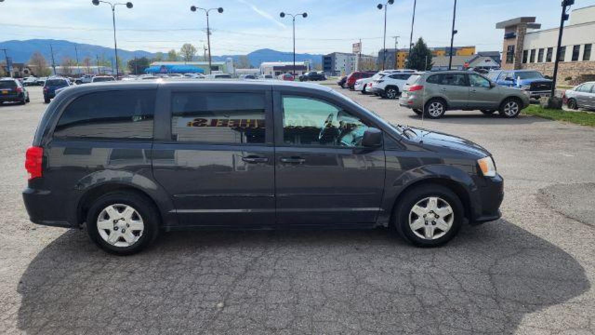 2012 Dark Charcoal Pearl Dodge Grand Caravan SE (2C4RDGBG9CR) with an 3.6L V6 DOHC 24V engine, 6-Speed Automatic transmission, located at 1800 West Broadway, Missoula, 59808, (406) 543-1986, 46.881348, -114.023628 - Photo#2