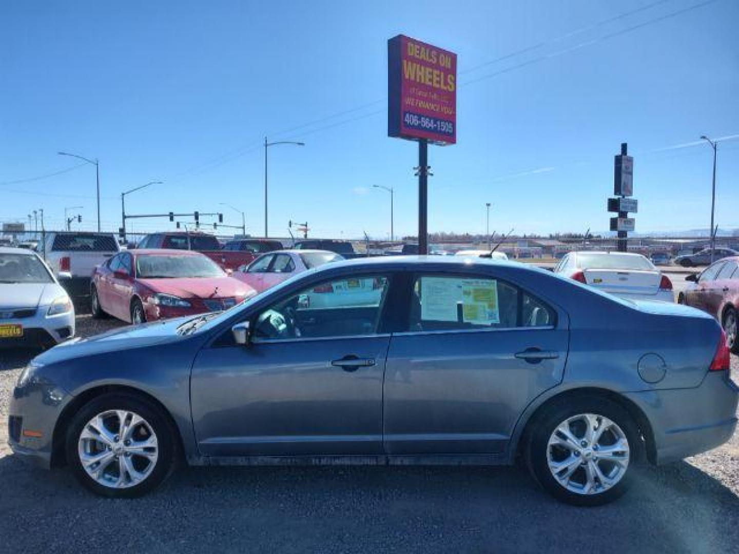 2012 Ford Fusion SE (3FAHP0HA0CR) with an 2.5L L4 DOHC 16V engine, located at 4801 10th Ave S,, Great Falls, MT, 59405, 47.494347, -111.229942 - Photo#1