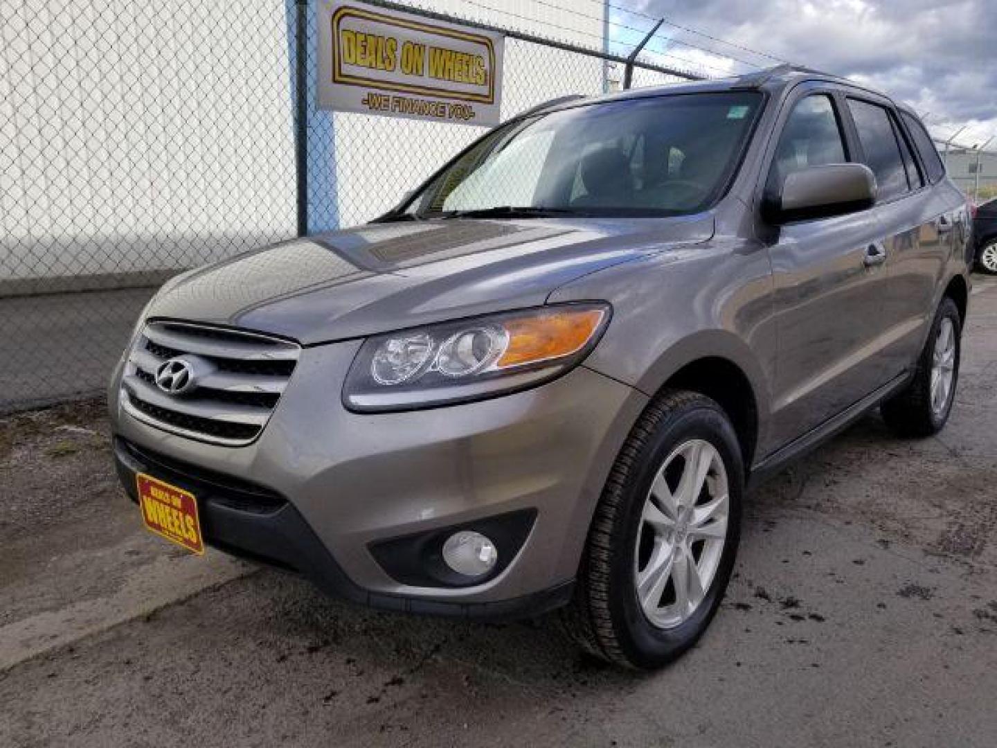 2012 Hyundai Santa Fe SE 3.5 4WD (5XYZHDAG9CG) with an 3.5L V6 DOHC 24V engine, 6-Speed Automatic transmission, located at 601 E. Idaho St., Kalispell, MT, 59901, 48.203983, -114.308662 - Photo#0