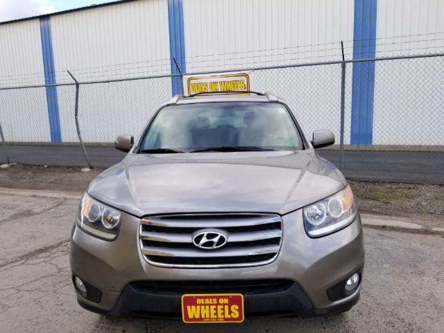 2012 Hyundai Santa Fe SE 3.5 4WD (5XYZHDAG9CG) with an 3.5L V6 DOHC 24V engine, 6-Speed Automatic transmission, located at 601 E. Idaho St., Kalispell, MT, 59901, 48.203983, -114.308662 - Photo#1