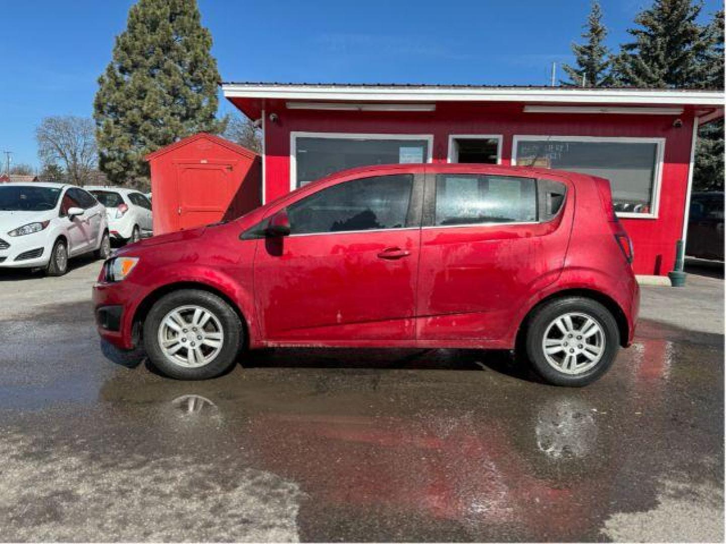 2013 Chevrolet Sonic LT Auto 5-Door (1G1JC6SB7D4) with an 1.4L L4 DOHC 24V TURBO engine, 6-Speed Automatic transmission, located at 601 E. Idaho St., Kalispell, MT, 59901, 48.203983, -114.308662 - Photo#1