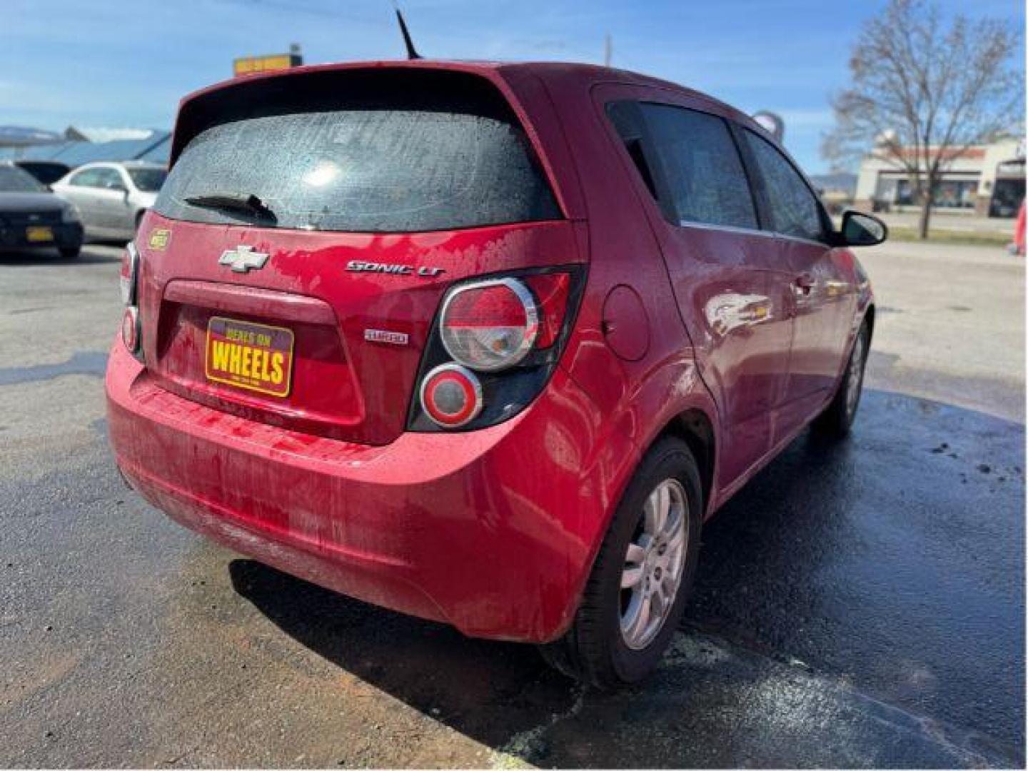 2013 Chevrolet Sonic LT Auto 5-Door (1G1JC6SB7D4) with an 1.4L L4 DOHC 24V TURBO engine, 6-Speed Automatic transmission, located at 601 E. Idaho St., Kalispell, MT, 59901, 48.203983, -114.308662 - Photo#2