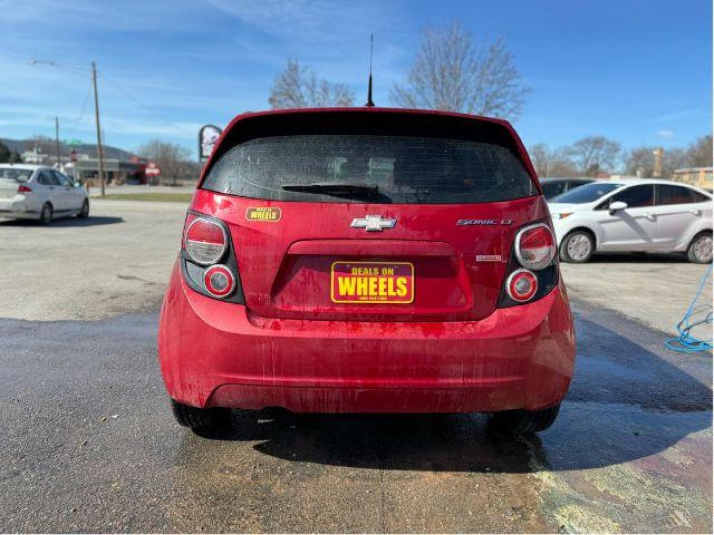 2013 Chevrolet Sonic LT Auto 5-Door (1G1JC6SB7D4) with an 1.4L L4 DOHC 24V TURBO engine, 6-Speed Automatic transmission, located at 601 E. Idaho St., Kalispell, MT, 59901, 48.203983, -114.308662 - Photo#4