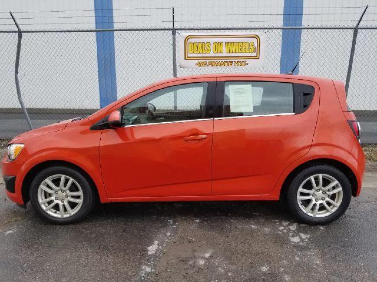 2013 Chevrolet Sonic LT Auto 5-Door (1G1JC6SH9D4) with an 1.8L L4 DOHC 24V engine, 6-Speed Automatic transmission, located at 601 E. Idaho St., Kalispell, MT, 59901, 48.203983, -114.308662 - Photo#2