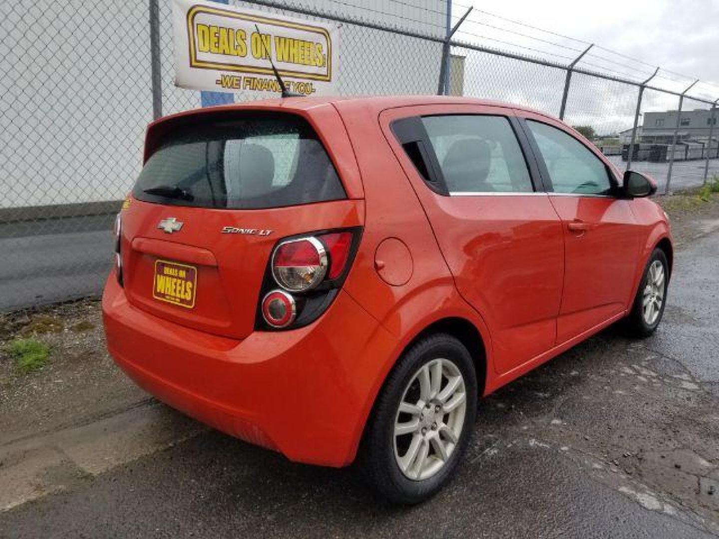 2013 Chevrolet Sonic LT Auto 5-Door (1G1JC6SH9D4) with an 1.8L L4 DOHC 24V engine, 6-Speed Automatic transmission, located at 601 E. Idaho St., Kalispell, MT, 59901, 48.203983, -114.308662 - Photo#4