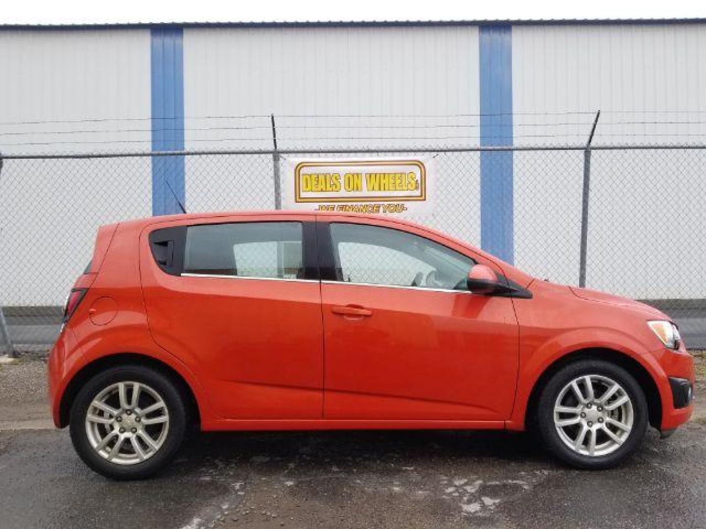 2013 Chevrolet Sonic LT Auto 5-Door (1G1JC6SH9D4) with an 1.8L L4 DOHC 24V engine, 6-Speed Automatic transmission, located at 601 E. Idaho St., Kalispell, MT, 59901, 48.203983, -114.308662 - Photo#5