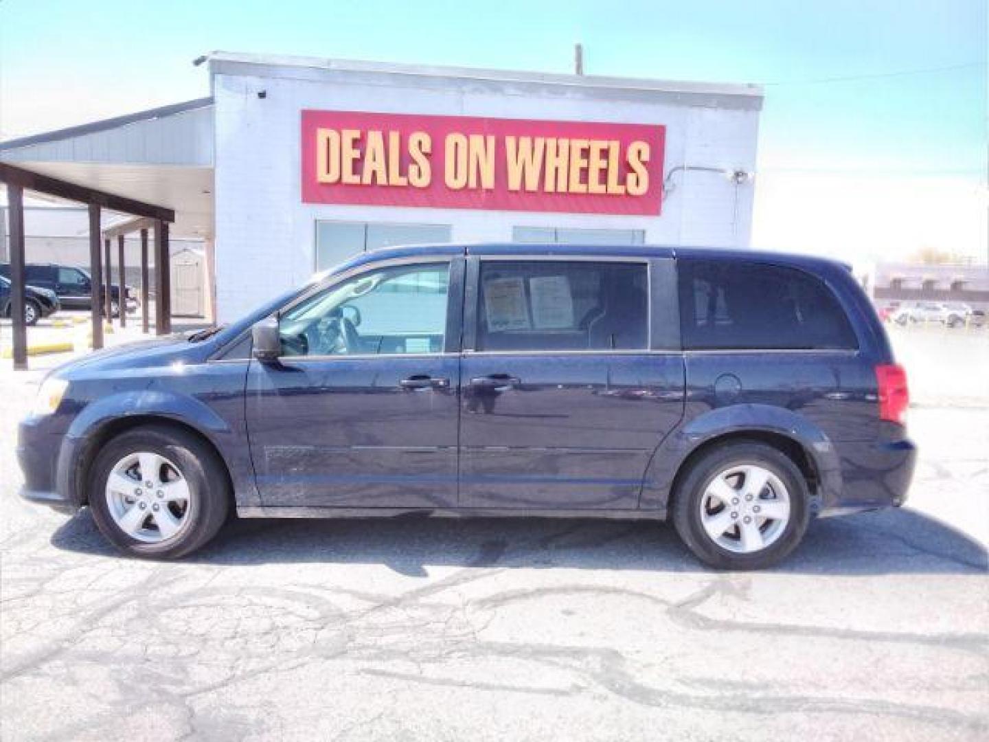 2013 Blue Streak Pearl Dodge Grand Caravan SE (2C4RDGBG5DR) with an 3.6L V6 DOHC 24V engine, 6-Speed Automatic transmission, located at 4047 Montana Ave., Billings, MT, 59101, 45.770847, -108.529800 - Photo#1