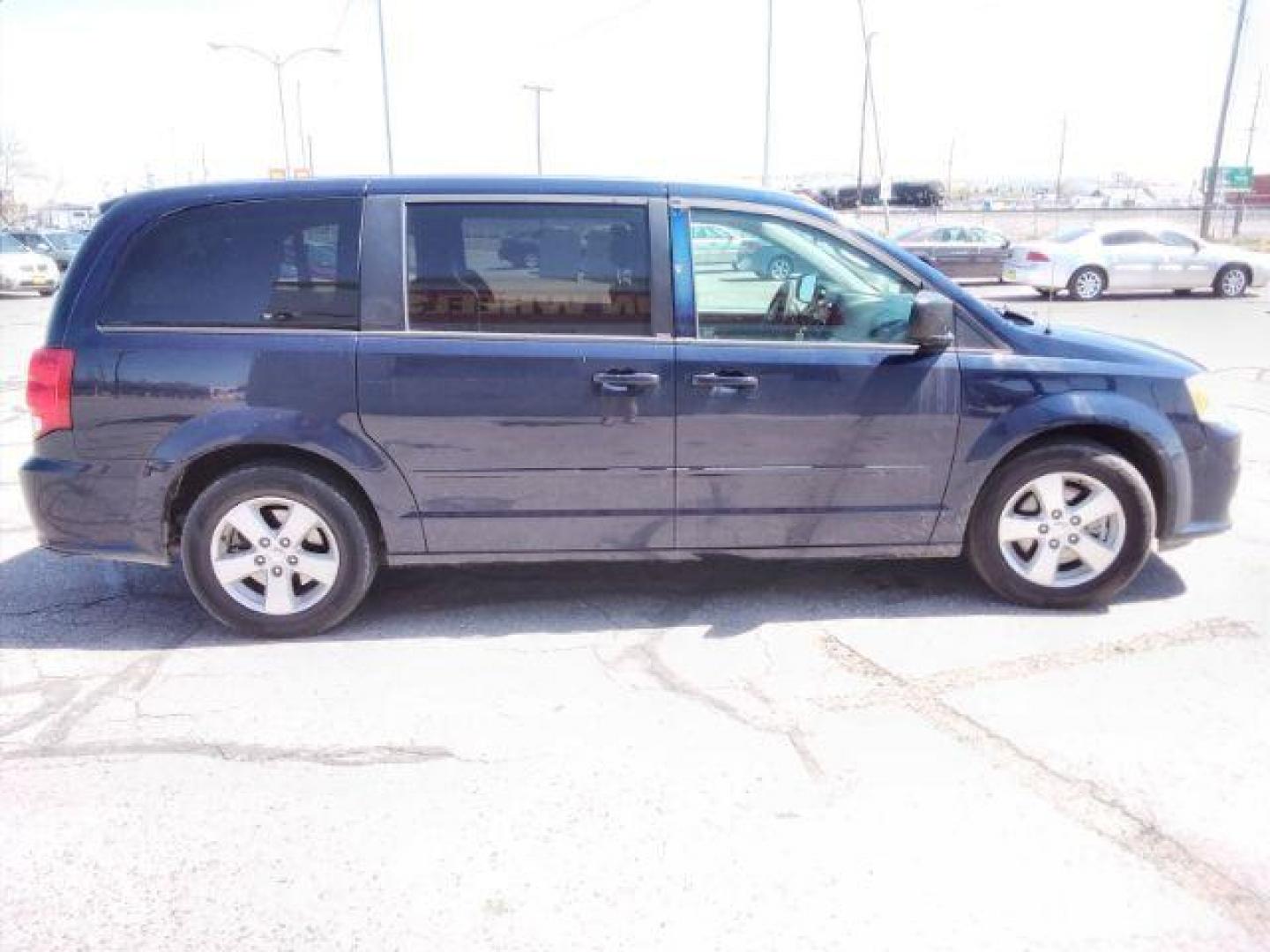 2013 Blue Streak Pearl Dodge Grand Caravan SE (2C4RDGBG5DR) with an 3.6L V6 DOHC 24V engine, 6-Speed Automatic transmission, located at 4047 Montana Ave., Billings, MT, 59101, 45.770847, -108.529800 - Photo#5