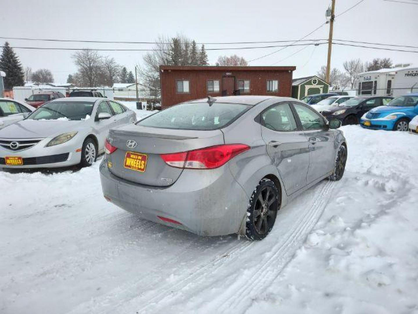 2013 Hyundai Elantra GLS A/T (KMHDH4AEXDU) with an 1.8L L4 DOHC 16V engine, 6-Speed Automatic transmission, located at 4801 10th Ave S,, Great Falls, MT, 59405, 47.494347, -111.229942 - Photo#4