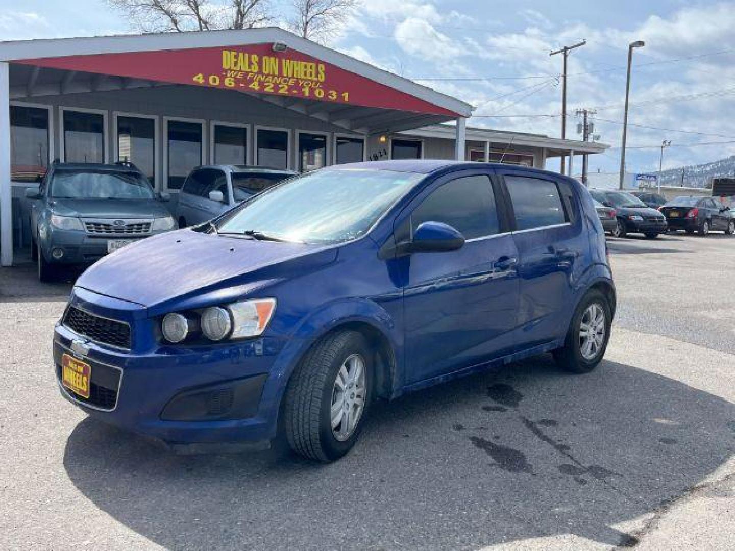 2014 Chevrolet Sonic LT Auto 5-Door (1G1JC6SG9E4) with an 1.8L L4 DOHC 24V engine, 6-Speed Automatic transmission, located at 1821 N Montana Ave., Helena, MT, 59601, 46.603447, -112.022781 - Photo#0