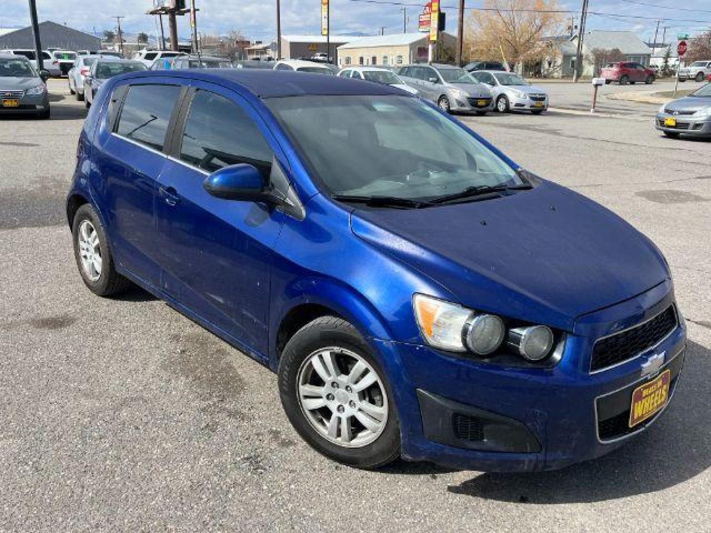 2014 Chevrolet Sonic LT Auto 5-Door (1G1JC6SG9E4) with an 1.8L L4 DOHC 24V engine, 6-Speed Automatic transmission, located at 1821 N Montana Ave., Helena, MT, 59601, 46.603447, -112.022781 - Photo#2