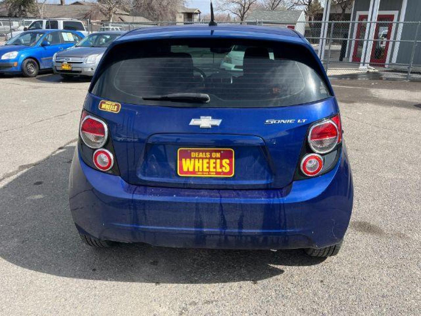 2014 Chevrolet Sonic LT Auto 5-Door (1G1JC6SG9E4) with an 1.8L L4 DOHC 24V engine, 6-Speed Automatic transmission, located at 1821 N Montana Ave., Helena, MT, 59601, 46.603447, -112.022781 - Photo#4