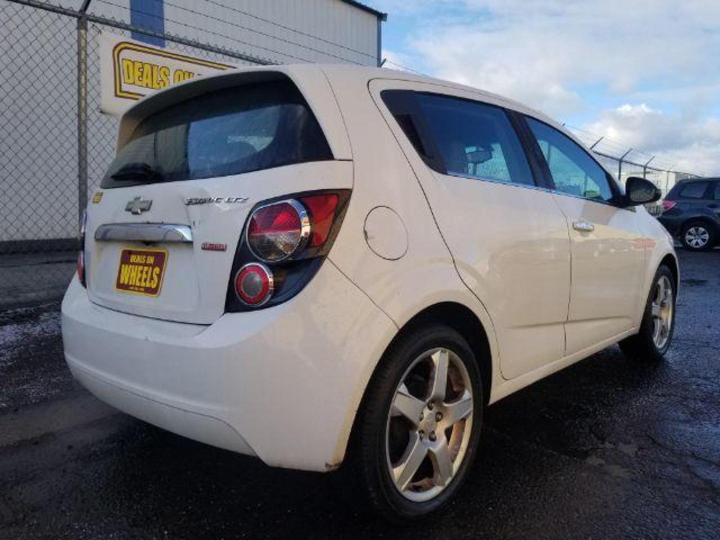 2014 Chevrolet Sonic LTZ Auto 5-Door (1G1JE6SB2E4) with an 1.4L L4 DOHC 24V TURBO engine, 6-Speed Automatic transmission, located at 4801 10th Ave S,, Great Falls, MT, 59405, 47.494347, -111.229942 - Photo#4