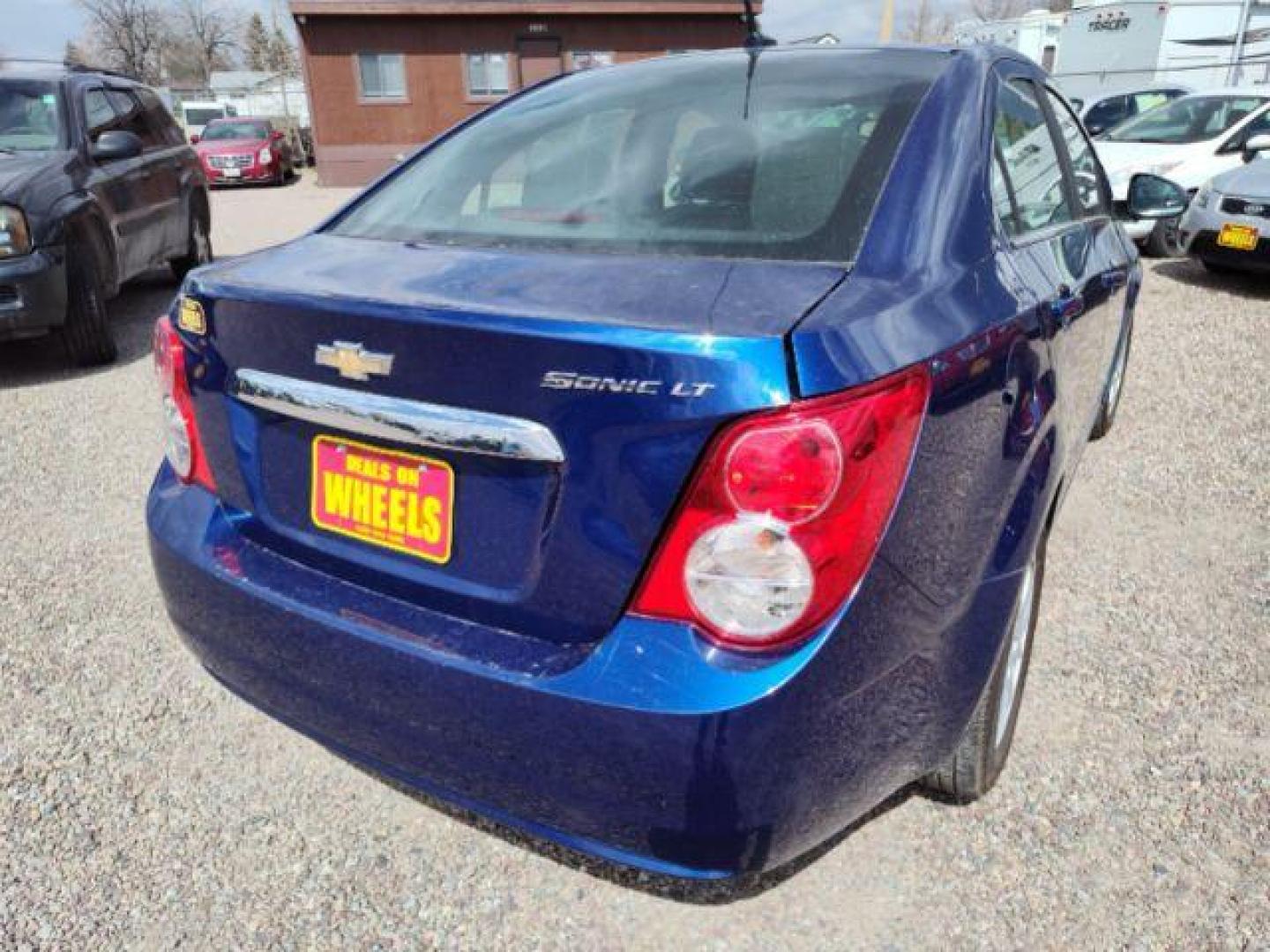 2014 Chevrolet Sonic LT Auto Sedan (1G1JC5SH6E4) with an 1.8L L4 DOHC 24V engine, 6-Speed Automatic transmission, located at 4801 10th Ave S,, Great Falls, MT, 59405, 47.494347, -111.229942 - Photo#4