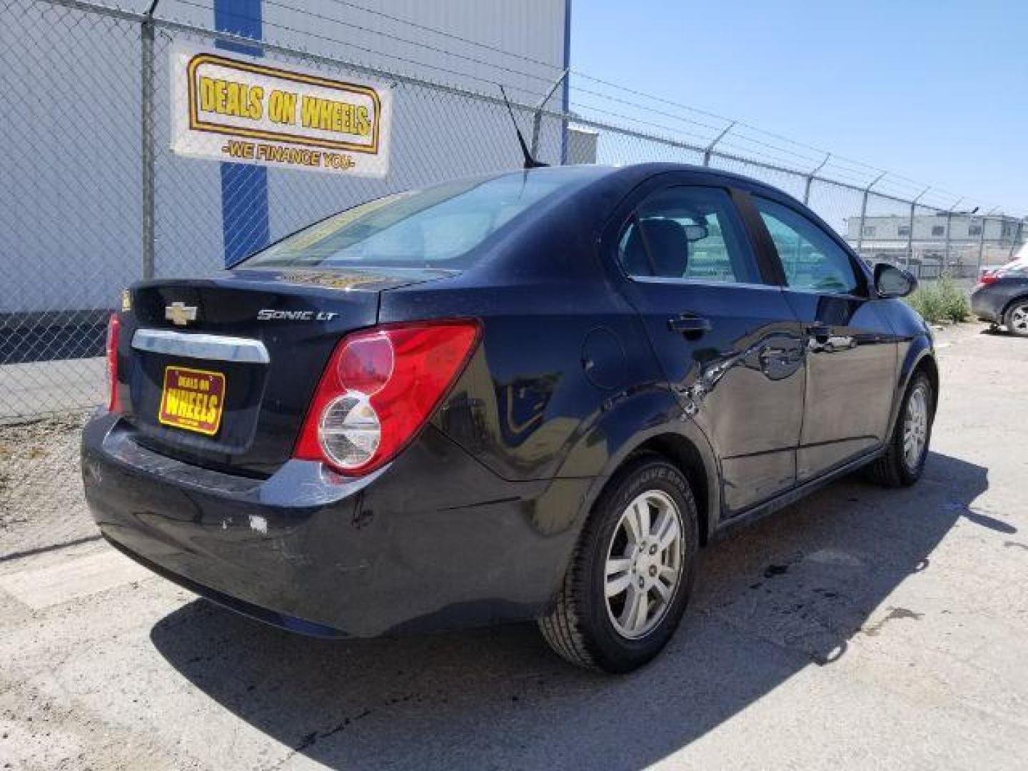 2014 Chevrolet Sonic LT Auto Sedan (1G1JC5SH7E4) with an 1.8L L4 DOHC 24V engine, 6-Speed Automatic transmission, located at 1821 N Montana Ave., Helena, MT, 59601, 46.603447, -112.022781 - Photo#11