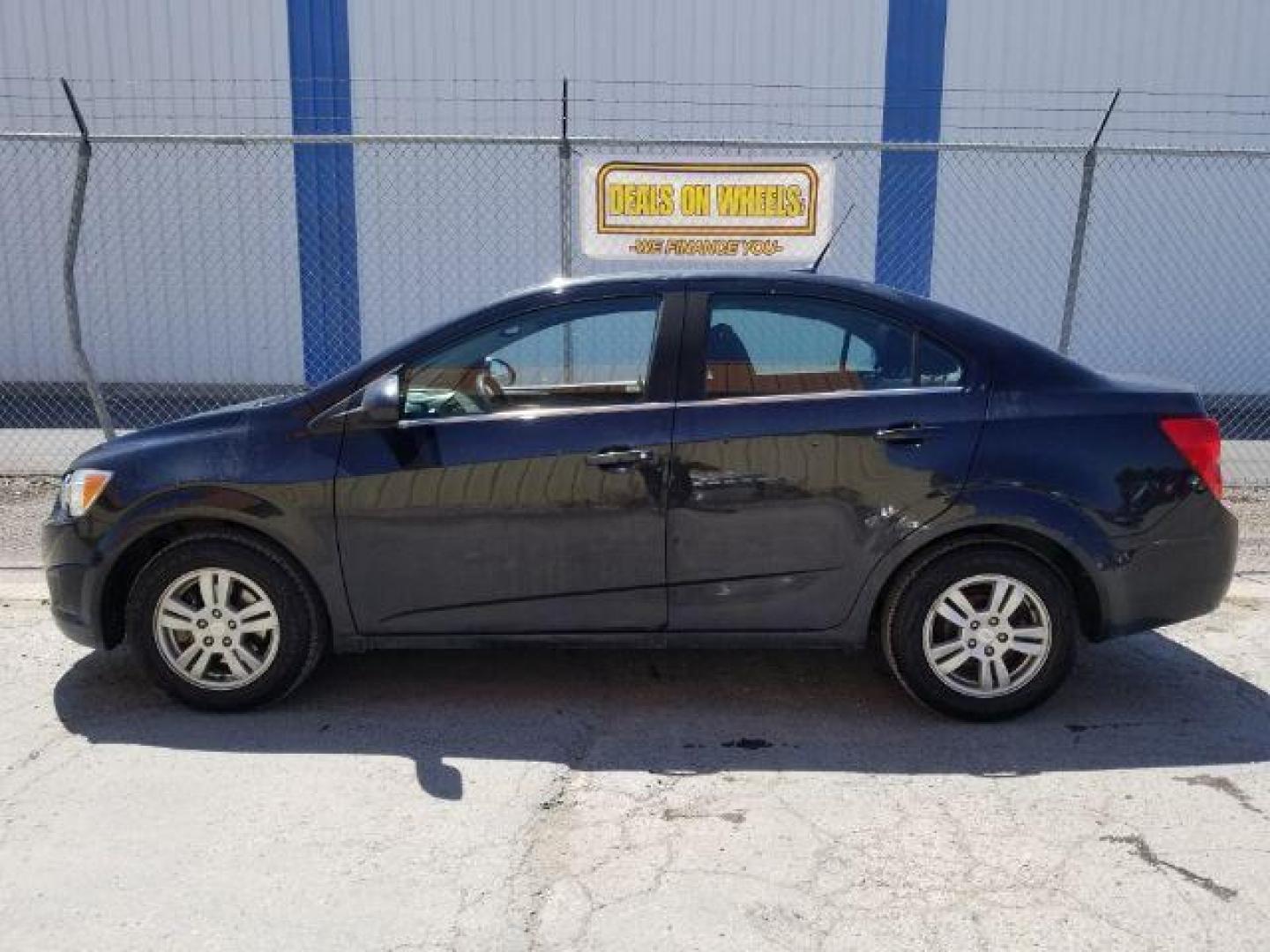 2014 Chevrolet Sonic LT Auto Sedan (1G1JC5SH7E4) with an 1.8L L4 DOHC 24V engine, 6-Speed Automatic transmission, located at 1821 N Montana Ave., Helena, MT, 59601, 46.603447, -112.022781 - Photo#12