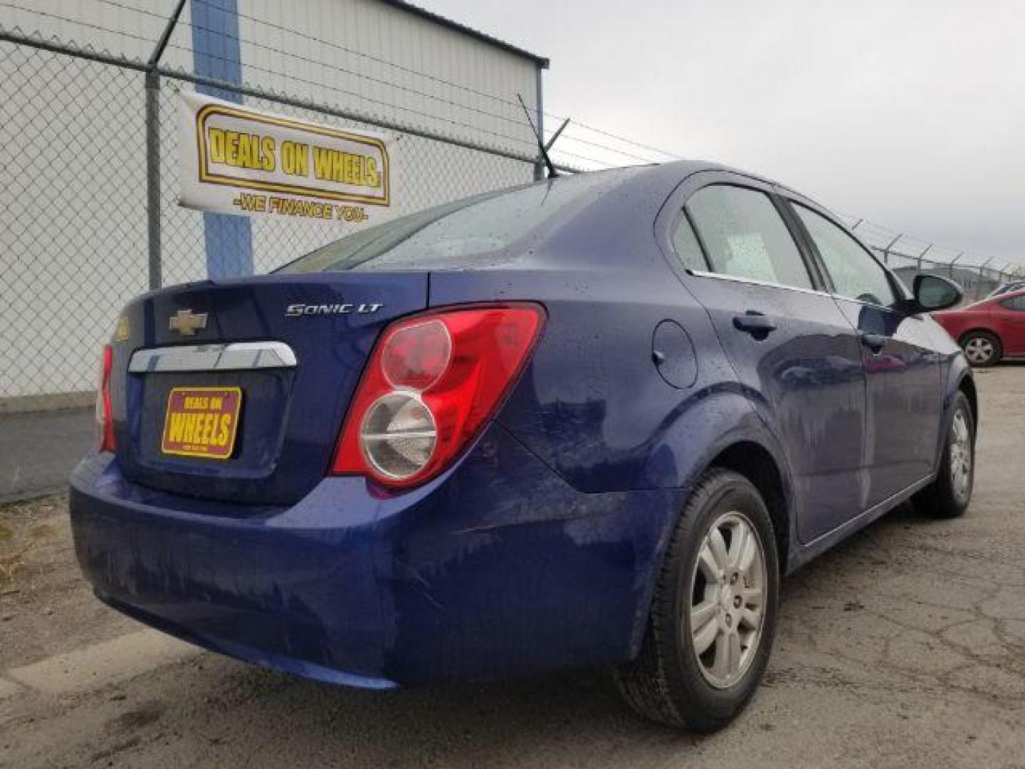 2014 Chevrolet Sonic LT Auto Sedan (1G1JC5SH7E4) with an 1.8L L4 DOHC 24V engine, 6-Speed Automatic transmission, located at 601 E. Idaho St., Kalispell, MT, 59901, 48.203983, -114.308662 - Photo#4