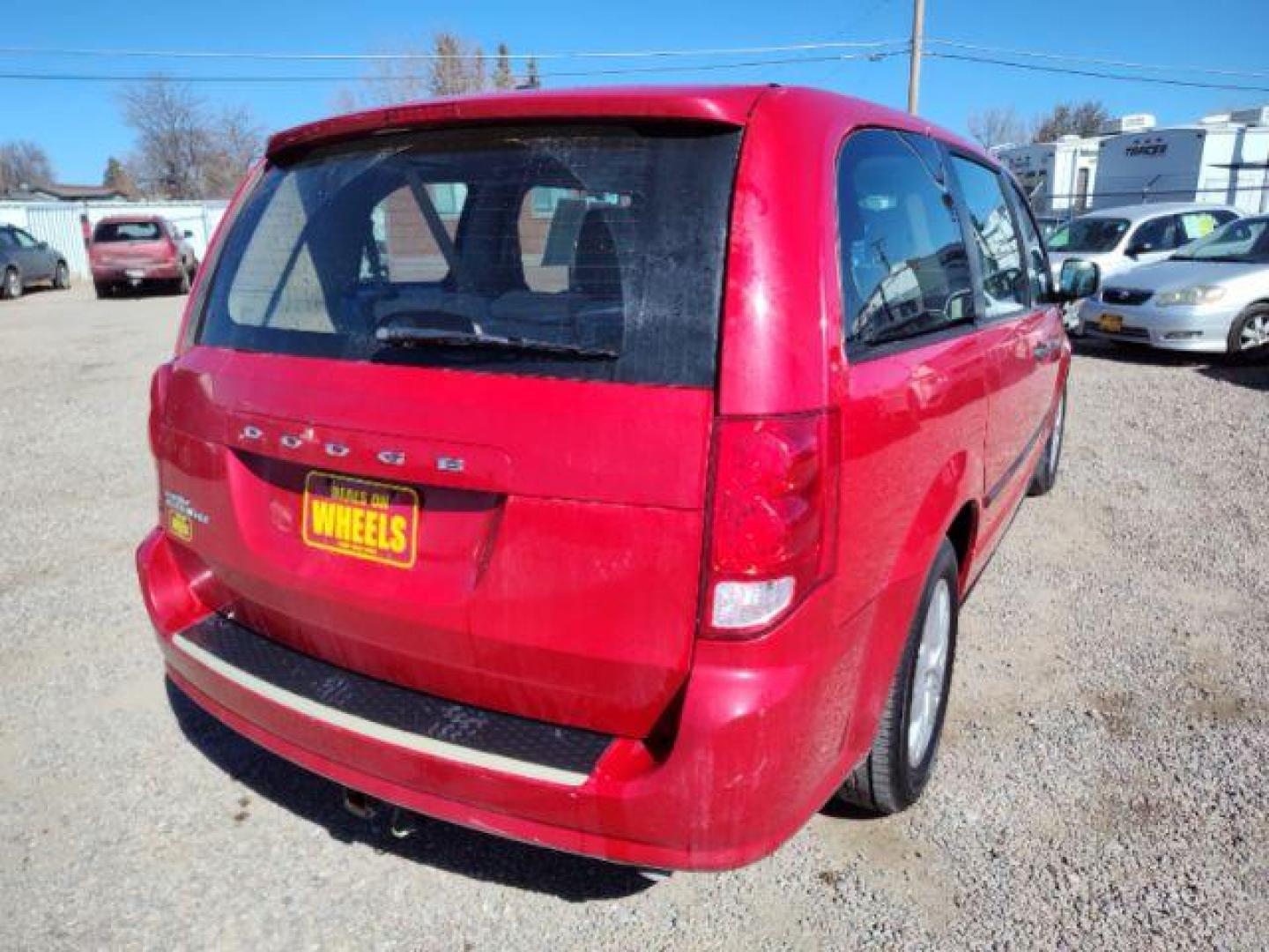 2014 Dodge Grand Caravan SE (2C4RDGBG2ER) with an 3.6L V6 DOHC 24V engine, 6-Speed Automatic transmission, located at 4801 10th Ave S,, Great Falls, MT, 59405, 47.494347, -111.229942 - Photo#4