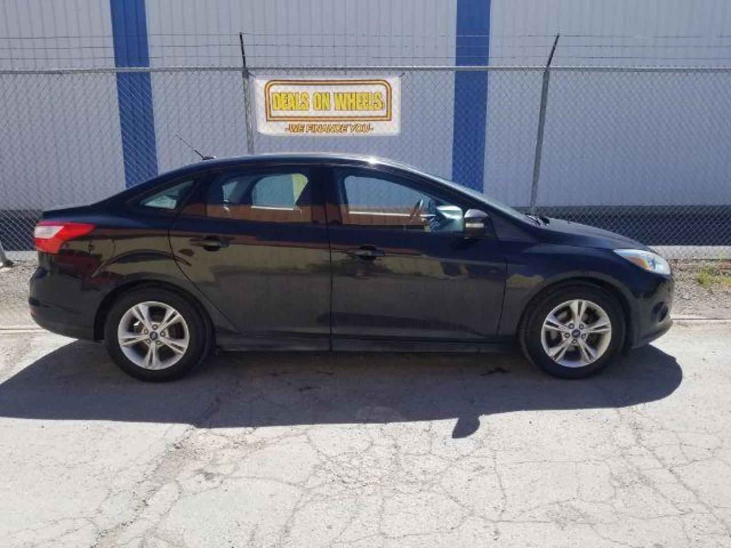 2014 Ford Focus SE Sedan (1FADP3F20EL) with an 2.0L L4 DOHC 16V engine, located at 4801 10th Ave S,, Great Falls, MT, 59405, 47.494347, -111.229942 - Photo#9