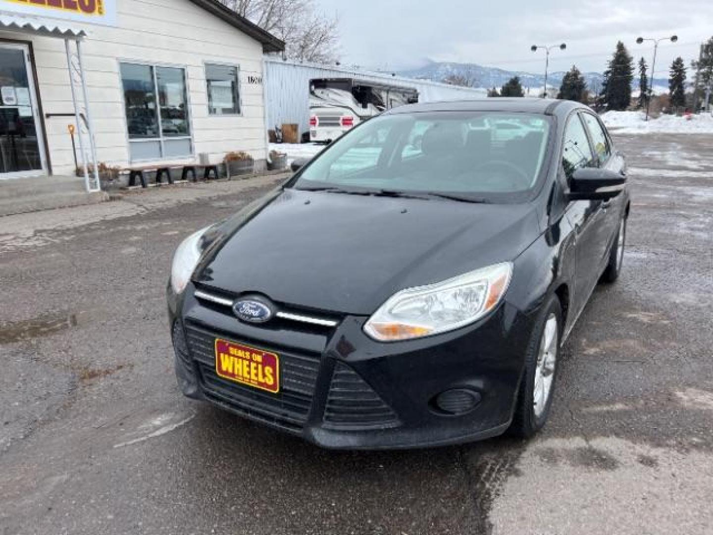 2014 Tuxedo Black Metalli Ford Focus SE Sedan (1FADP3F20EL) with an 2.0L L4 DOHC 16V engine, located at 1800 West Broadway, Missoula, 59808, (406) 543-1986, 46.881348, -114.023628 - Looking for a reliable and affordable pre-owned vehicle in Missoula? Look no further than this 2014 Ford Focus SE Sedan available at DOW - Missoula. With a price tag of $15,495, this vehicle offers great value for your money. The Ford Focus is a popular choice among sedan lovers, and this 2014 mod - Photo#0