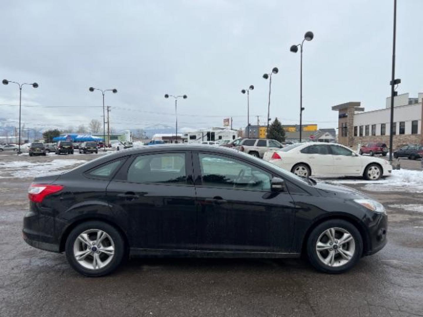 2014 Tuxedo Black Metalli Ford Focus SE Sedan (1FADP3F20EL) with an 2.0L L4 DOHC 16V engine, located at 1800 West Broadway, Missoula, 59808, (406) 543-1986, 46.881348, -114.023628 - Looking for a reliable and affordable pre-owned vehicle in Missoula? Look no further than this 2014 Ford Focus SE Sedan available at DOW - Missoula. With a price tag of $15,495, this vehicle offers great value for your money. The Ford Focus is a popular choice among sedan lovers, and this 2014 mod - Photo#2