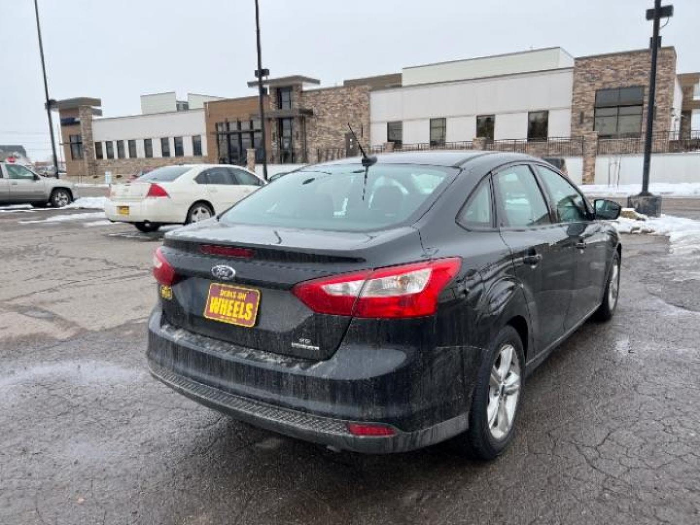 2014 Tuxedo Black Metalli Ford Focus SE Sedan (1FADP3F20EL) with an 2.0L L4 DOHC 16V engine, located at 1800 West Broadway, Missoula, 59808, (406) 543-1986, 46.881348, -114.023628 - Looking for a reliable and affordable pre-owned vehicle in Missoula? Look no further than this 2014 Ford Focus SE Sedan available at DOW - Missoula. With a price tag of $15,495, this vehicle offers great value for your money. The Ford Focus is a popular choice among sedan lovers, and this 2014 mod - Photo#3