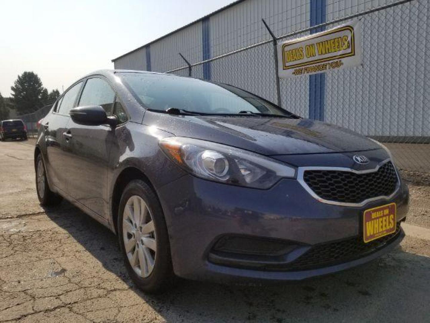 2014 Kia Forte EX (KNAFX4A66E5) with an 1.8L L4 DOHC 16V engine, 6-Speed Automatic transmission, located at 4047 Montana Ave., Billings, MT, 59101, 45.770847, -108.529800 - Photo#6