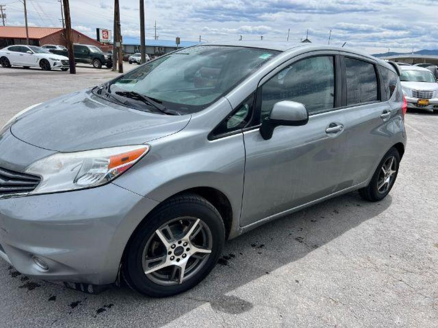 2014 Nissan Versa Note S (3N1CE2CPXEL) with an 1.6L L4 DOHC 16V engine, 5-Speed Manual transmission, located at 601 E. Idaho St., Kalispell, MT, 59901, 48.203983, -114.308662 - Photo#0