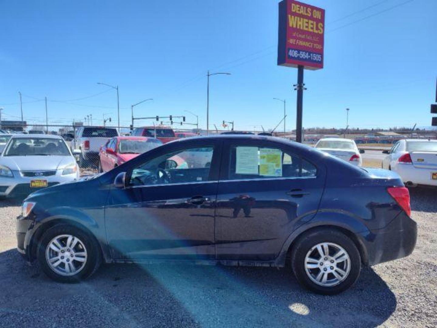 2015 Chevrolet Sonic LT Auto Sedan (1G1JC5SHXF4) with an 1.8L L4 DOHC 24V engine, 6-Speed Automatic transmission, located at 4801 10th Ave S,, Great Falls, MT, 59405, 47.494347, -111.229942 - Photo#1