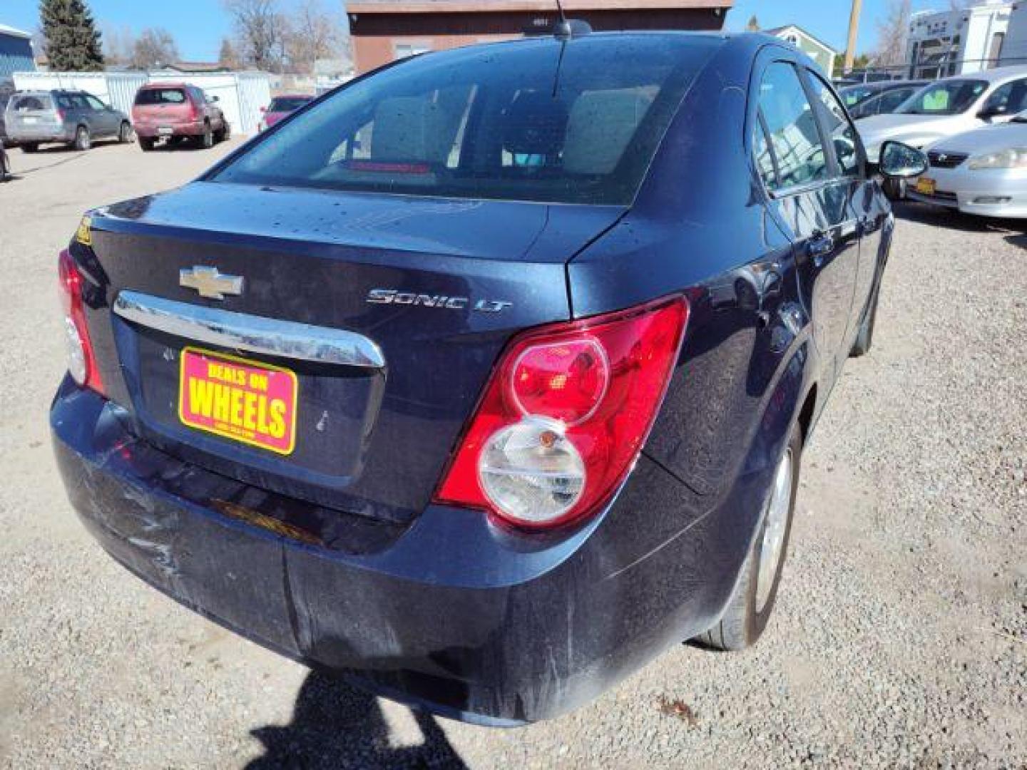 2015 Chevrolet Sonic LT Auto Sedan (1G1JC5SHXF4) with an 1.8L L4 DOHC 24V engine, 6-Speed Automatic transmission, located at 4801 10th Ave S,, Great Falls, MT, 59405, 47.494347, -111.229942 - Photo#4