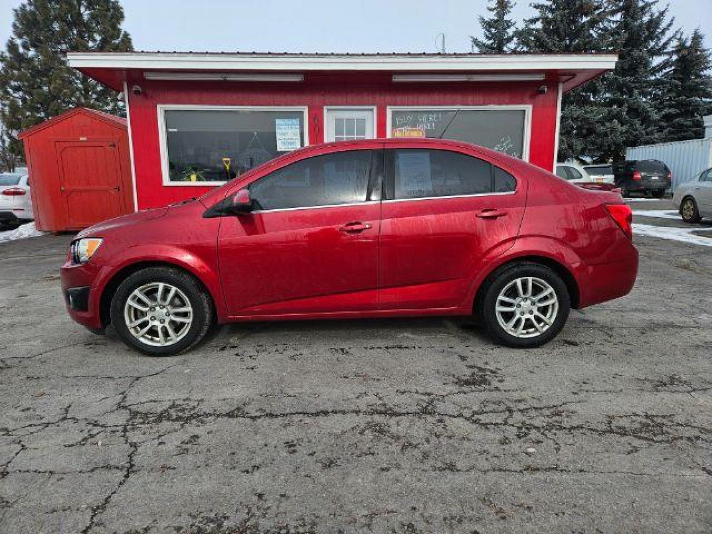 2015 Chevrolet Sonic LT Auto Sedan (1G1JC5SH4F4) with an 1.8L L4 DOHC 24V engine, 6-Speed Automatic transmission, located at 601 E. Idaho St., Kalispell, MT, 59901, 48.203983, -114.308662 - Photo#1