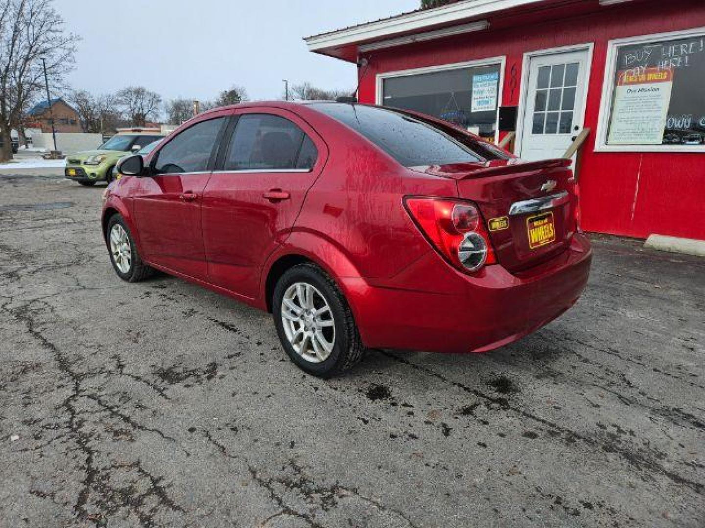 2015 Chevrolet Sonic LT Auto Sedan (1G1JC5SH4F4) with an 1.8L L4 DOHC 24V engine, 6-Speed Automatic transmission, located at 601 E. Idaho St., Kalispell, MT, 59901, 48.203983, -114.308662 - Photo#2