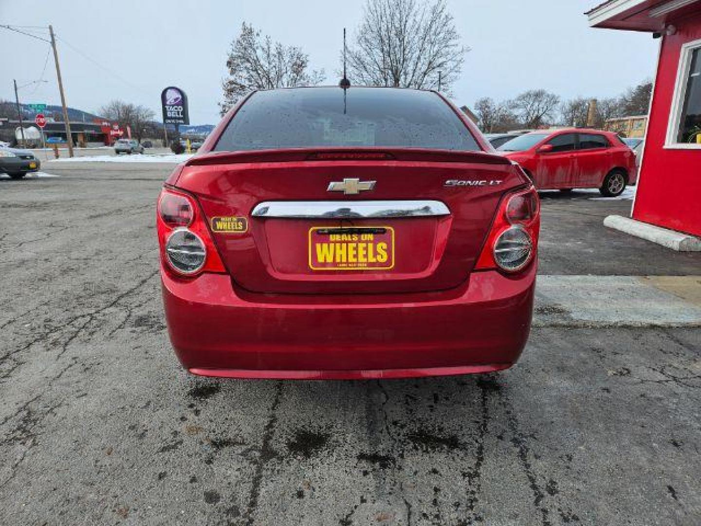 2015 Chevrolet Sonic LT Auto Sedan (1G1JC5SH4F4) with an 1.8L L4 DOHC 24V engine, 6-Speed Automatic transmission, located at 601 E. Idaho St., Kalispell, MT, 59901, 48.203983, -114.308662 - Photo#3