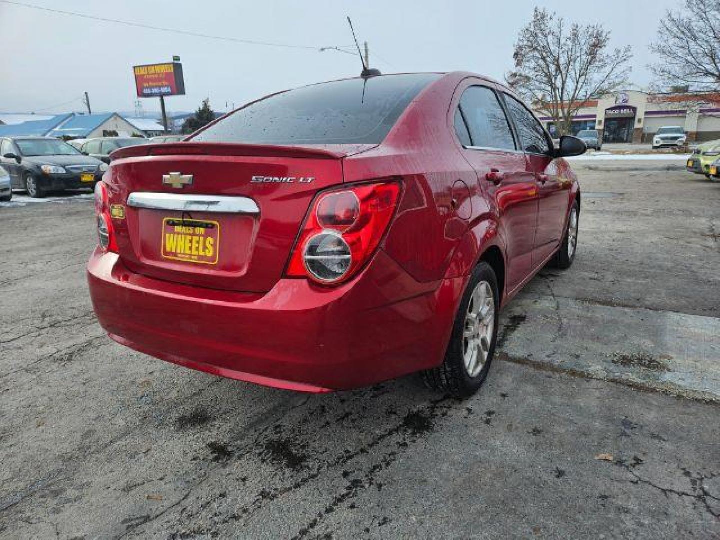 2015 Chevrolet Sonic LT Auto Sedan (1G1JC5SH4F4) with an 1.8L L4 DOHC 24V engine, 6-Speed Automatic transmission, located at 601 E. Idaho St., Kalispell, MT, 59901, 48.203983, -114.308662 - Photo#4