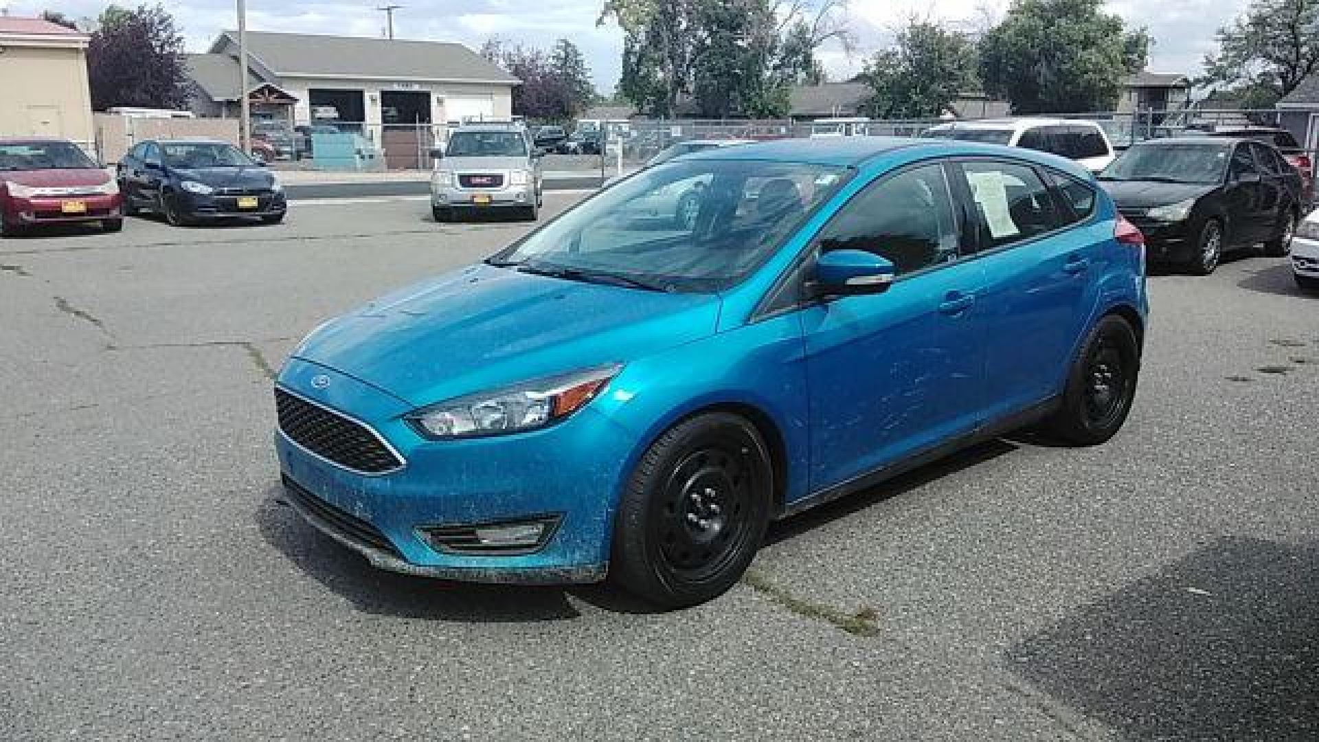 2015 Ford Focus SE Hatch (1FADP3K29FL) with an 2.0L L4 DOHC 16V engine, 5-Speed Manual transmission, located at 1821 N Montana Ave., Helena, MT, 59601, 46.603447, -112.022781 - Photo#0