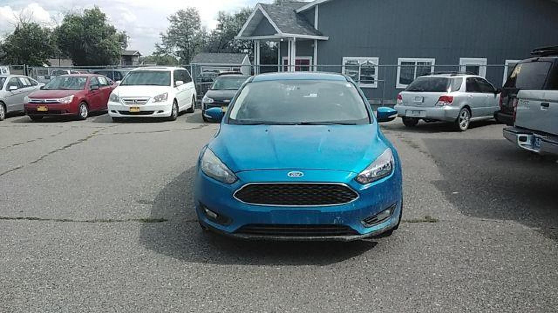 2015 Ford Focus SE Hatch (1FADP3K29FL) with an 2.0L L4 DOHC 16V engine, 5-Speed Manual transmission, located at 1821 N Montana Ave., Helena, MT, 59601, 46.603447, -112.022781 - Photo#1