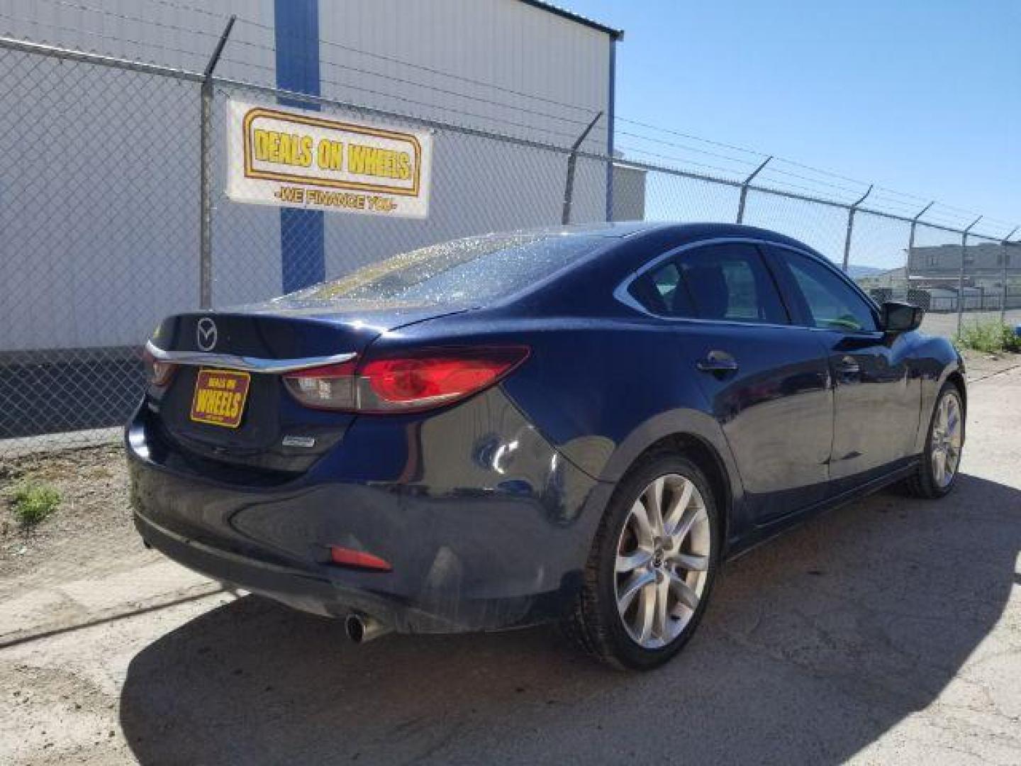 2015 Deep Crystal Blue Mazda Mazda6 i Touring (JM1GJ1V56F1) with an 2.5L L4 DOHC 16V engine, 6-Speed Automatic transmission, located at 4047 Montana Ave., Billings, MT, 59101, 45.770847, -108.529800 - Photo#4