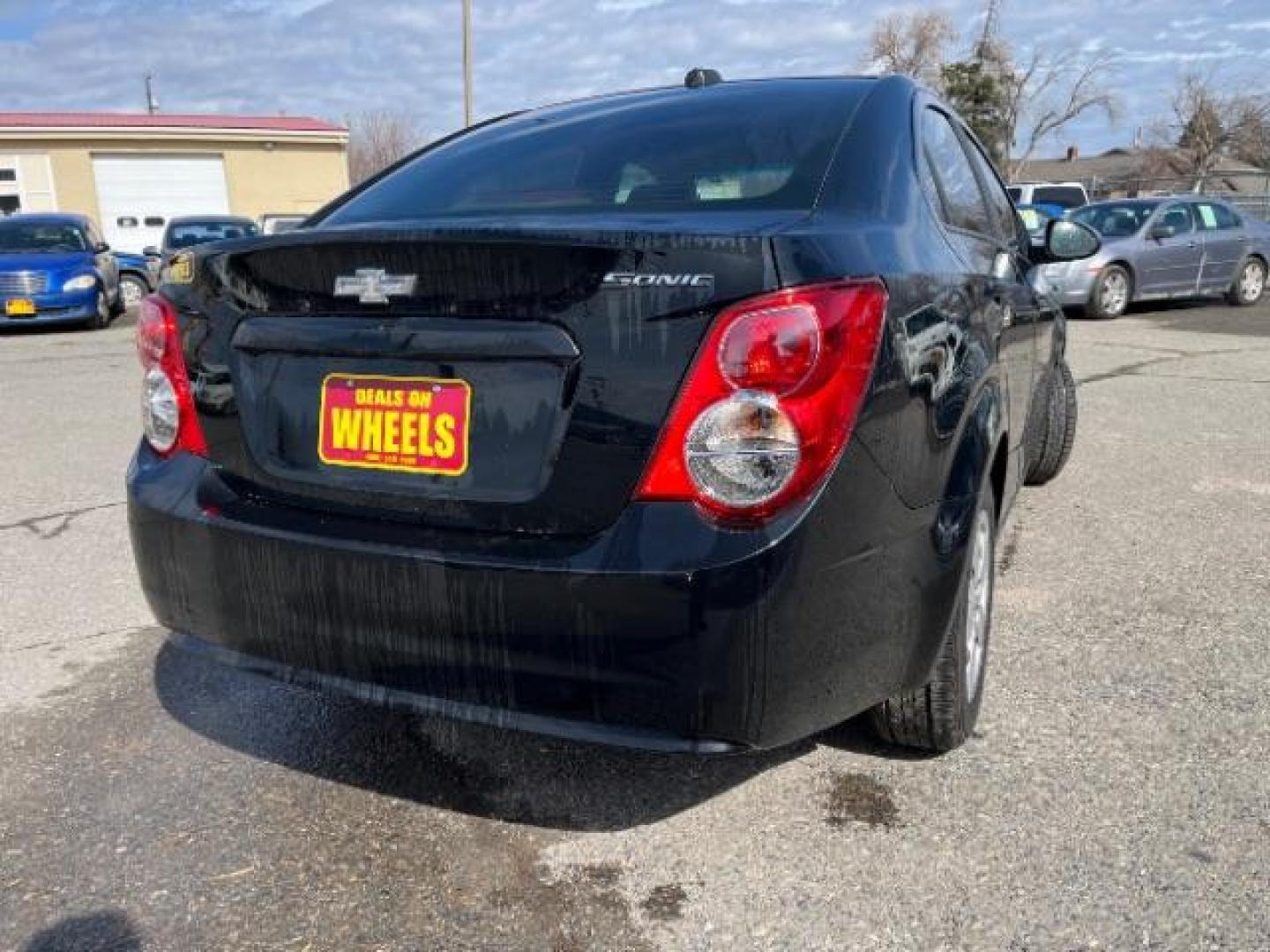 2016 Chevrolet Sonic LS Auto Sedan (1G1JA5SH2G4) with an 1.8L L4 DOHC 24V engine, 6-Speed Automatic transmission, located at 1821 N Montana Ave., Helena, MT, 59601, 46.603447, -112.022781 - Photo#2